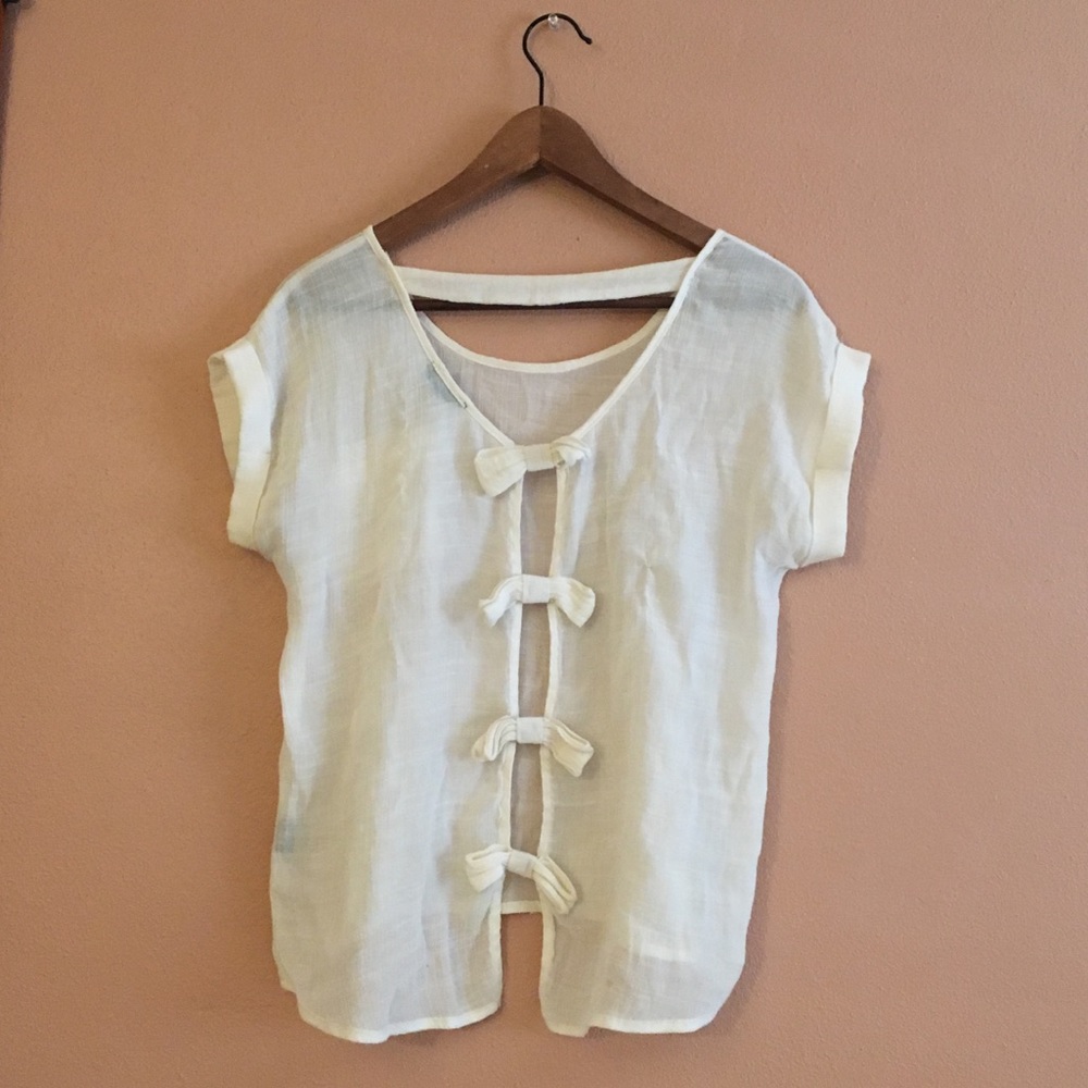 Gorgeous off-white blouse with open back slit